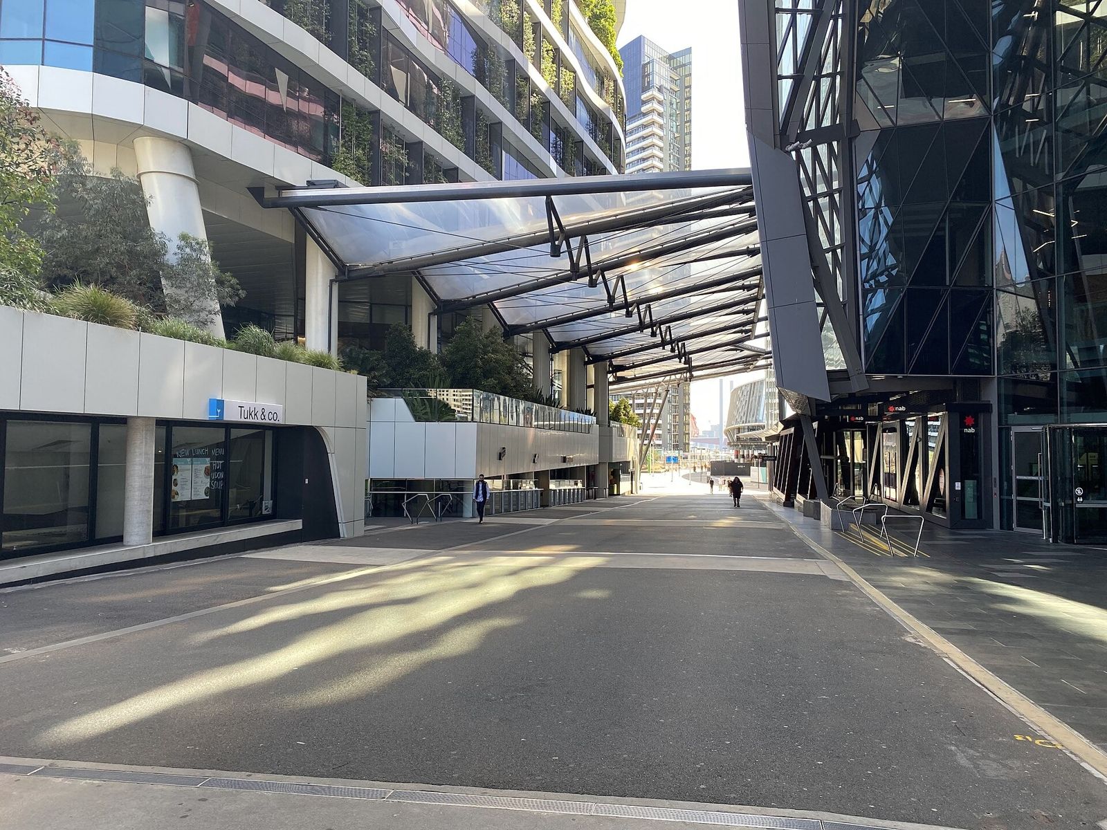 Medibank: A covered walkway along the base of the tower with a glass canopy