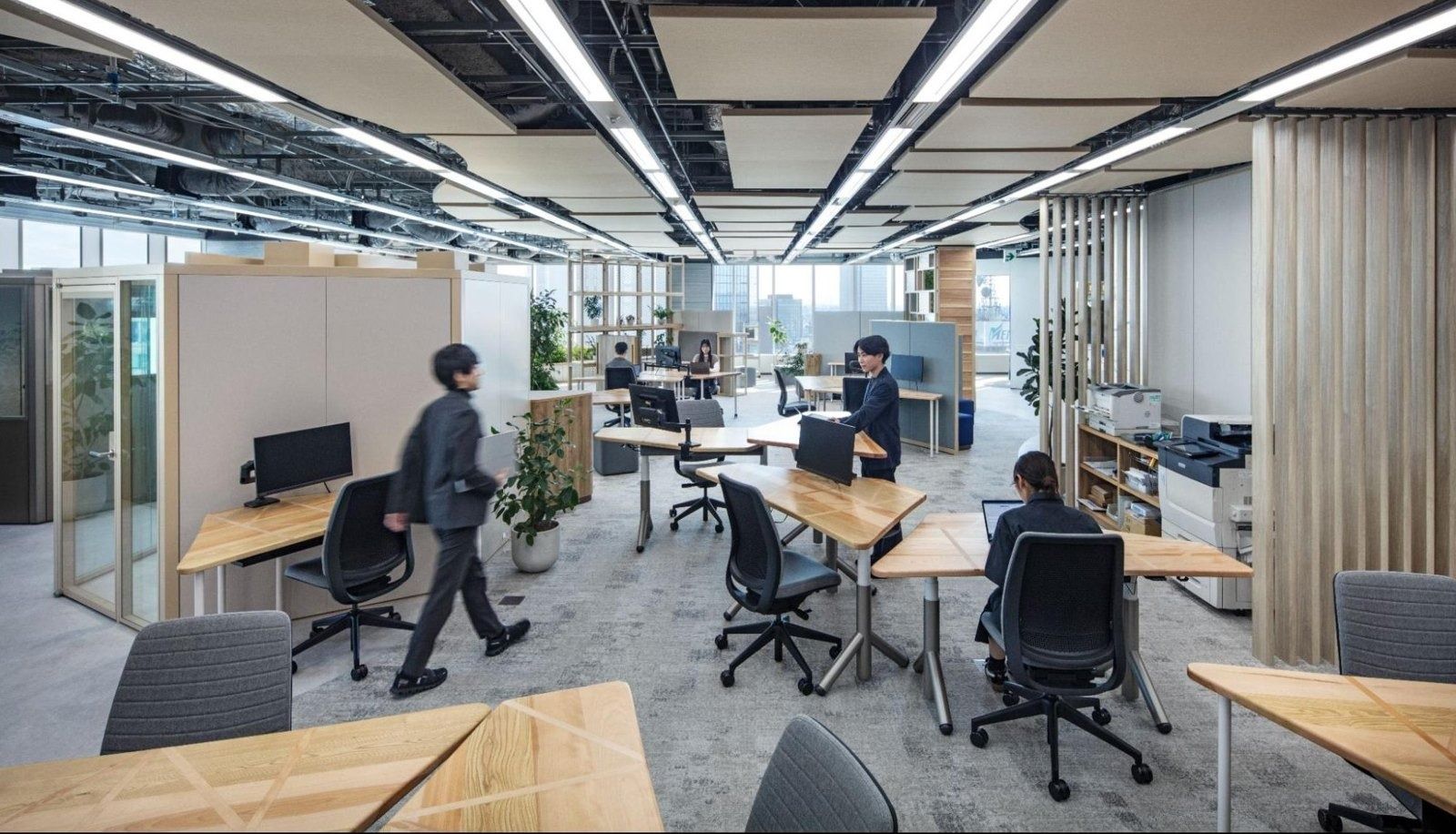 Mercari: Desks and meeting booths along a corridor