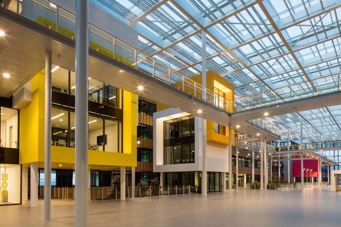 Michelin: Covered street with yellow and white boxes projecting from office floors