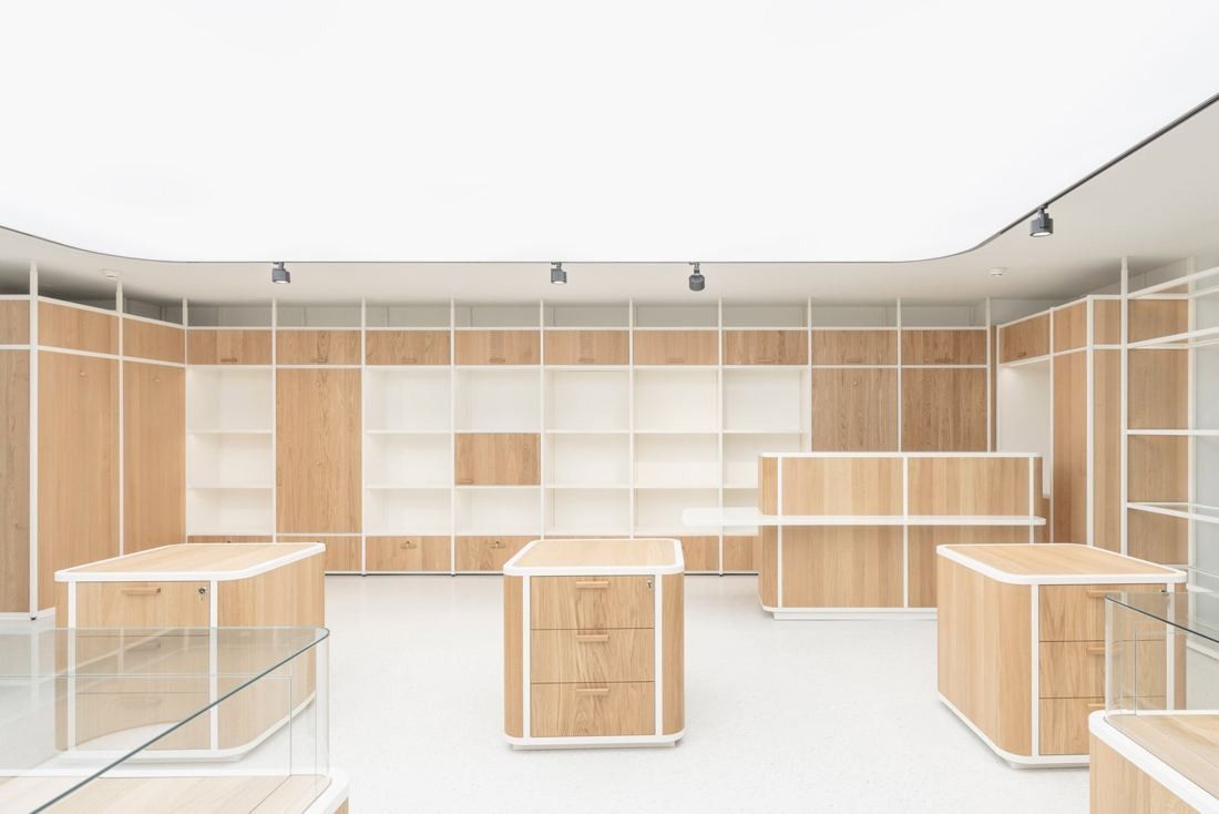 Michelin: White room with light-wood shelving and display counters