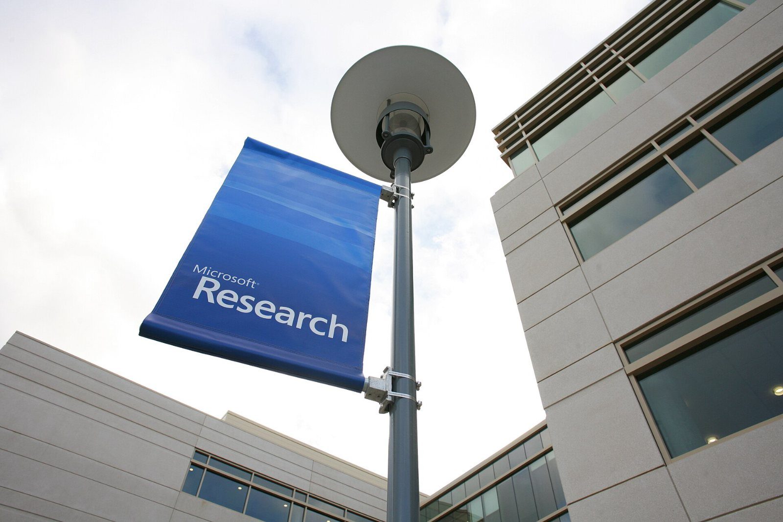 Banner reading Microsoft Research in front of a building