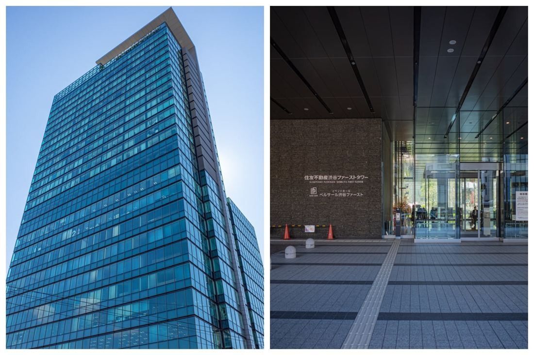 Blue glass office tower and its glazed entrance lobby