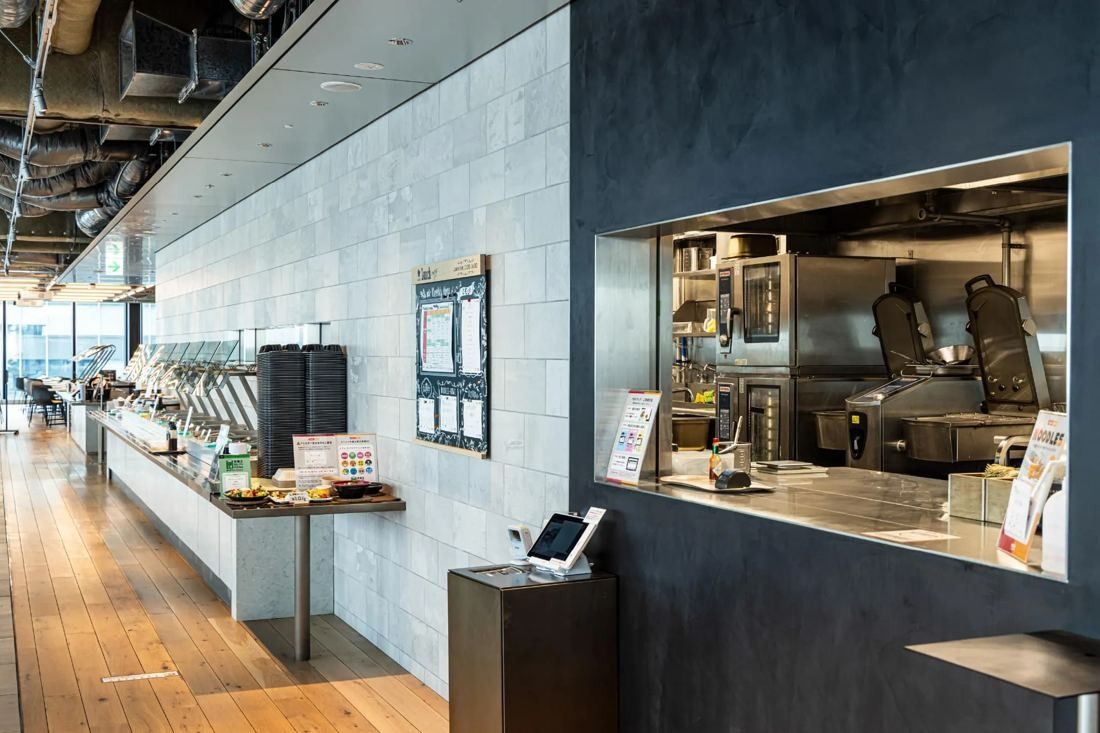 MIXI: Cafeteria serving counter with an open kitchen and wooden floor