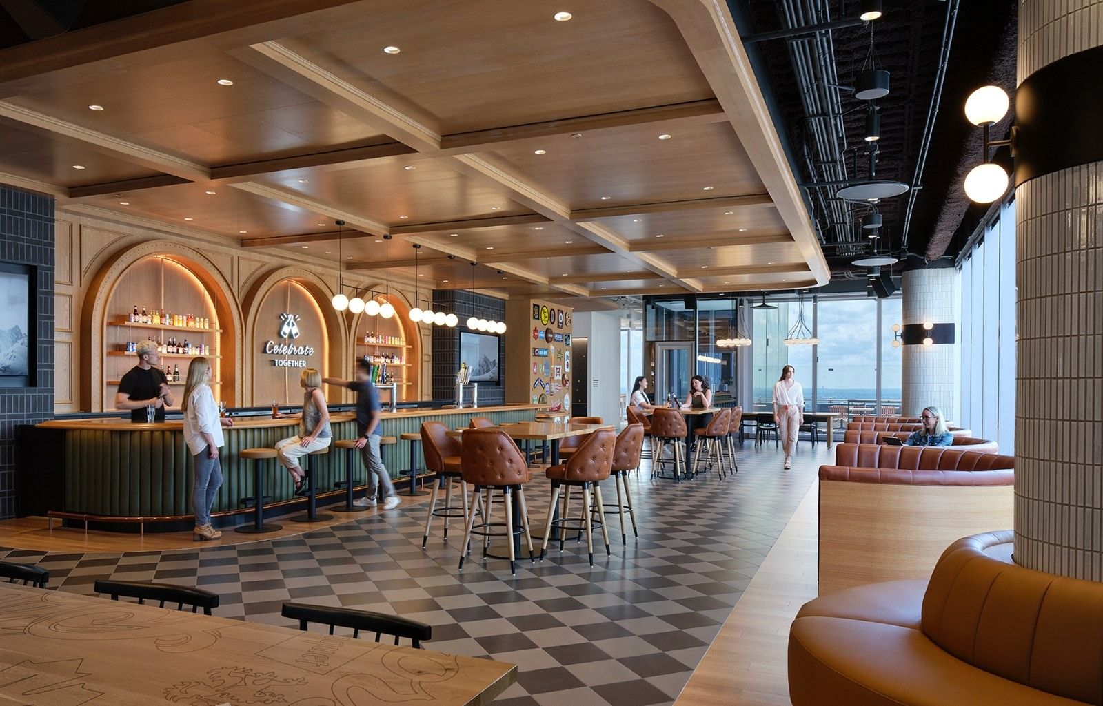 Molson Coors: A bar with arched shelves, stools and a checkered floor under a coffered wood ceiling