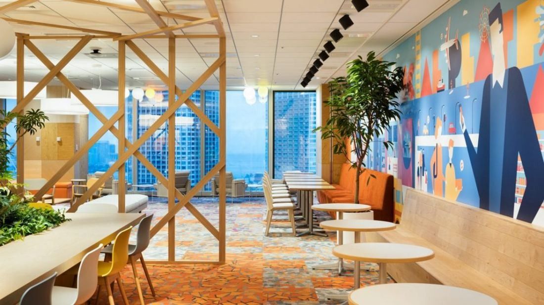 Money Forward: Lounge with timber lattice partitions, a colourful mural wall and tall windows overlooking towers