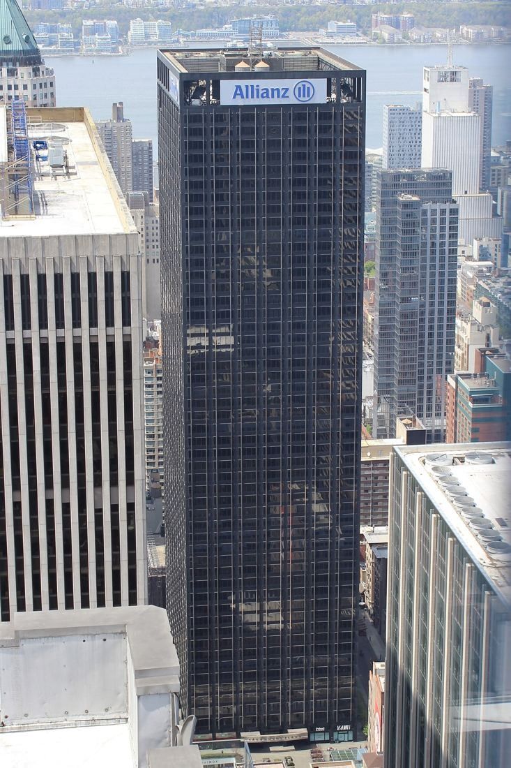 MongoDB: Aerial view of a dark office tower among Midtown Manhattan buildings
