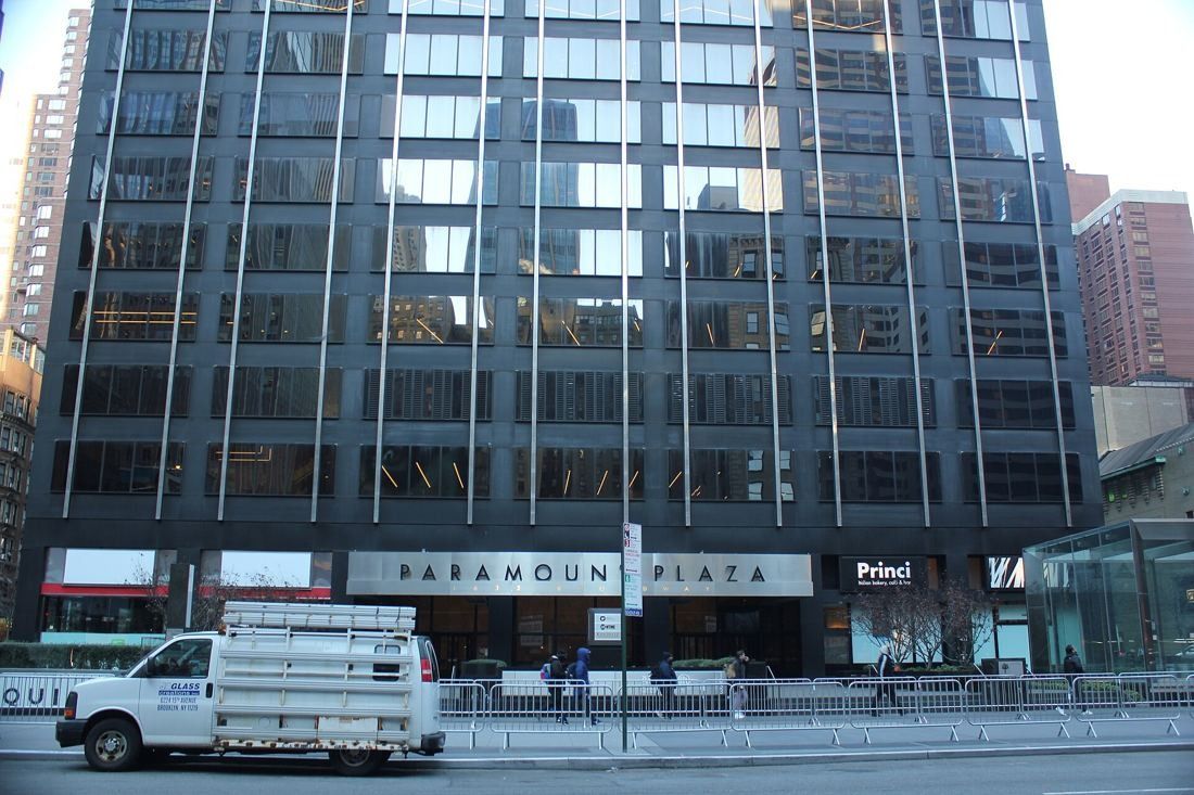 MongoDB: Ground floor of a dark office tower with a Paramount Plaza sign above the entrance