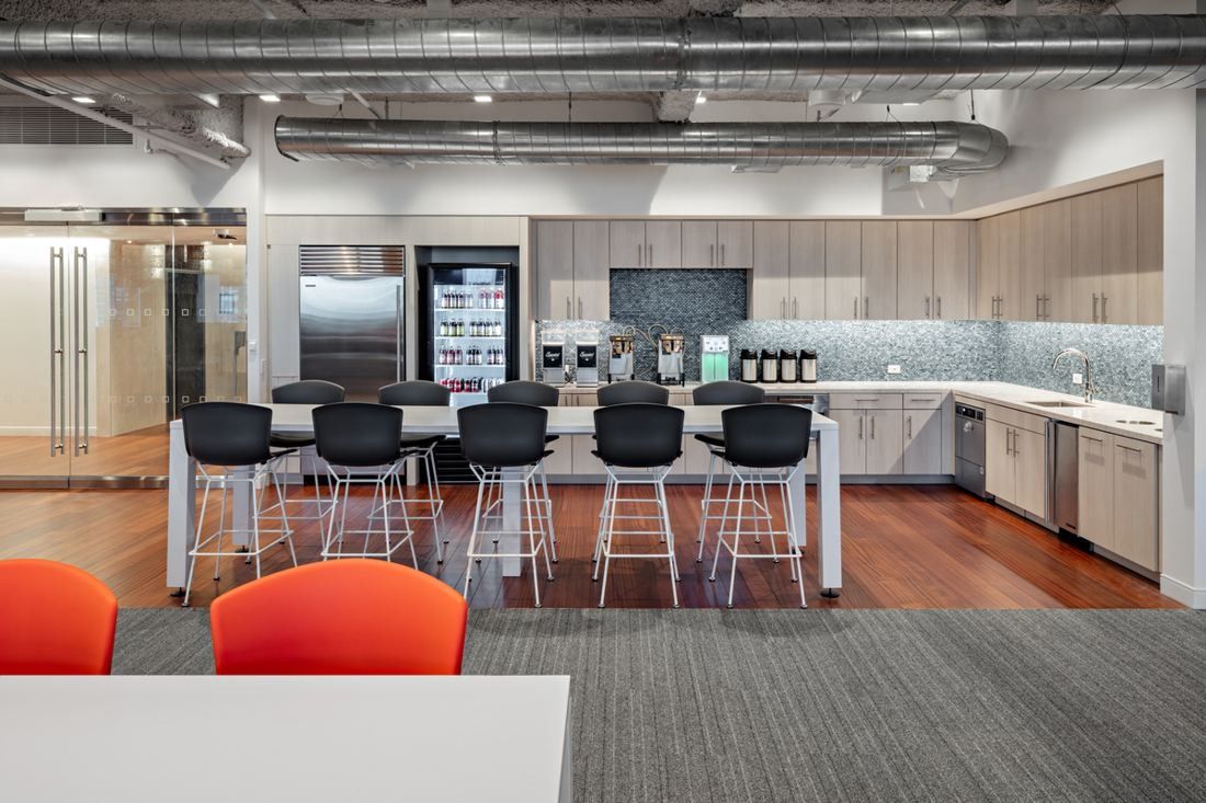 MongoDB: Kitchen pantry with counter, bar stools, refrigerators and coffee station