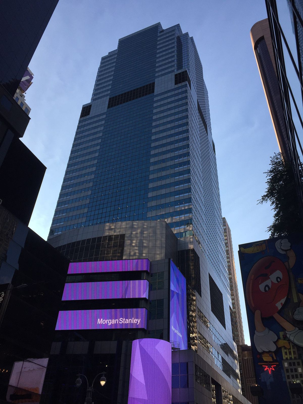 Morgan Stanley: Blue glass tower with a purple LED band at its base