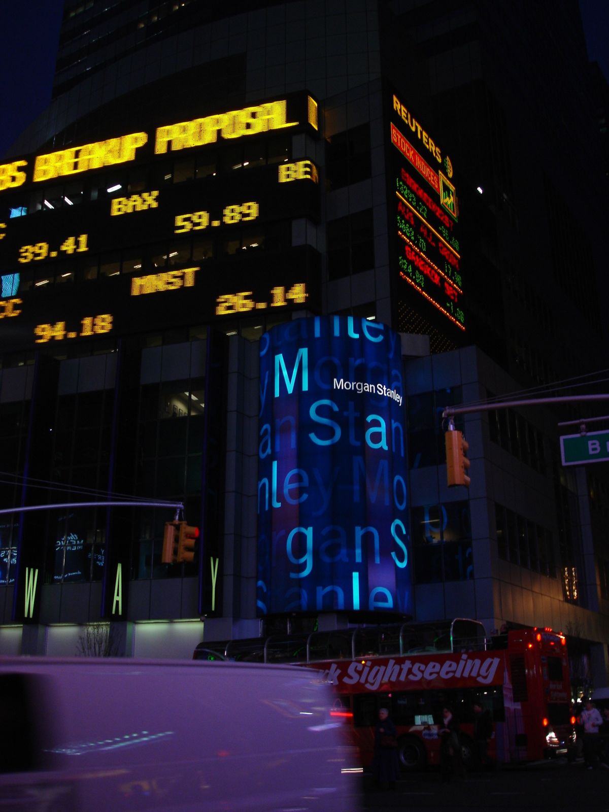 Morgan Stanley: Stock-quote ticker bands and a round LED sign at night