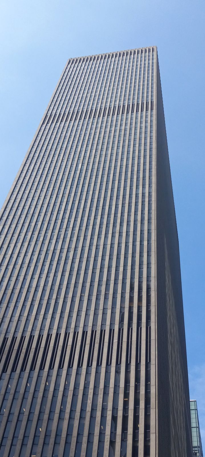 Tall dark office tower on Sixth Avenue