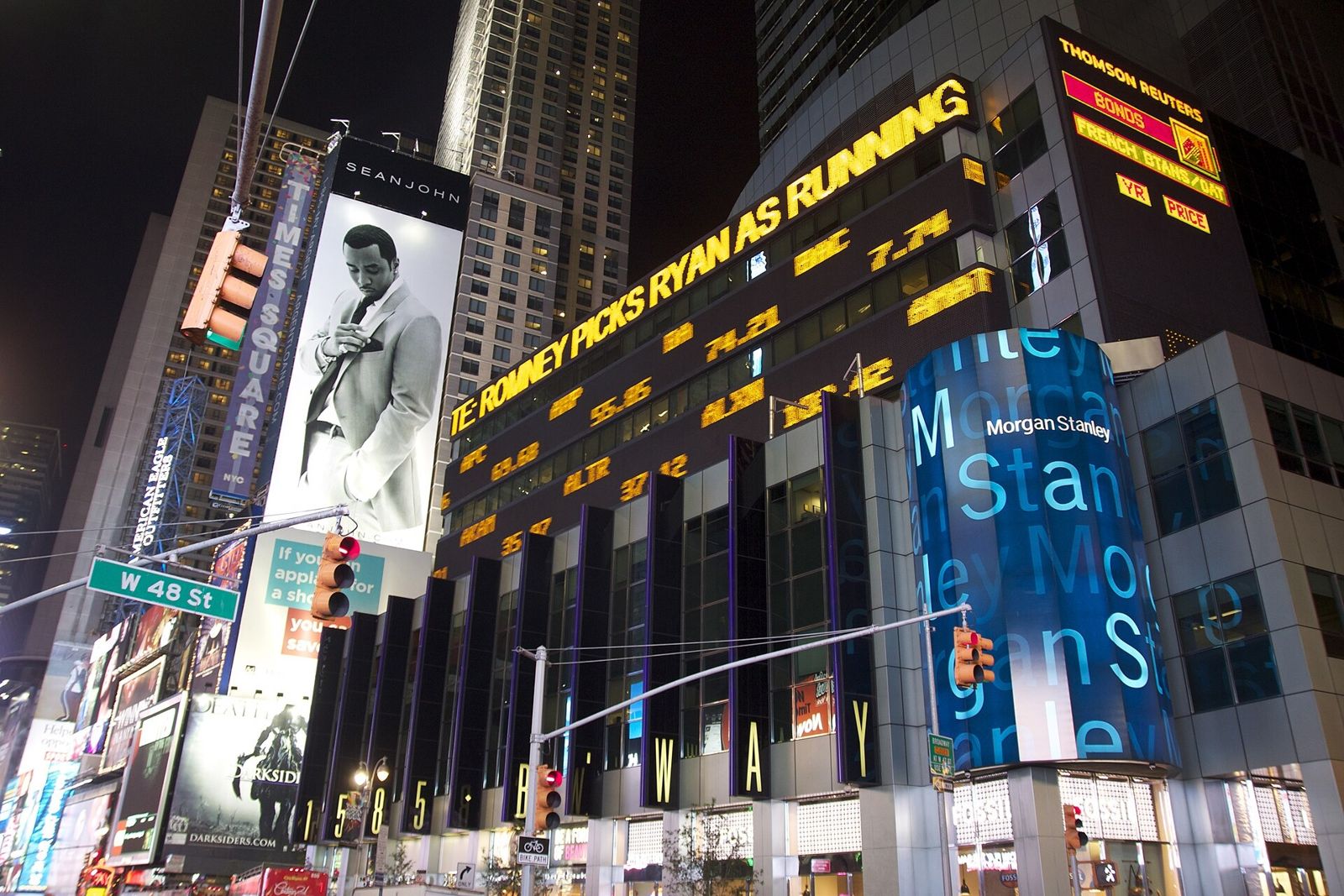 Morgan Stanley: Ticker bands and signs over the street at night