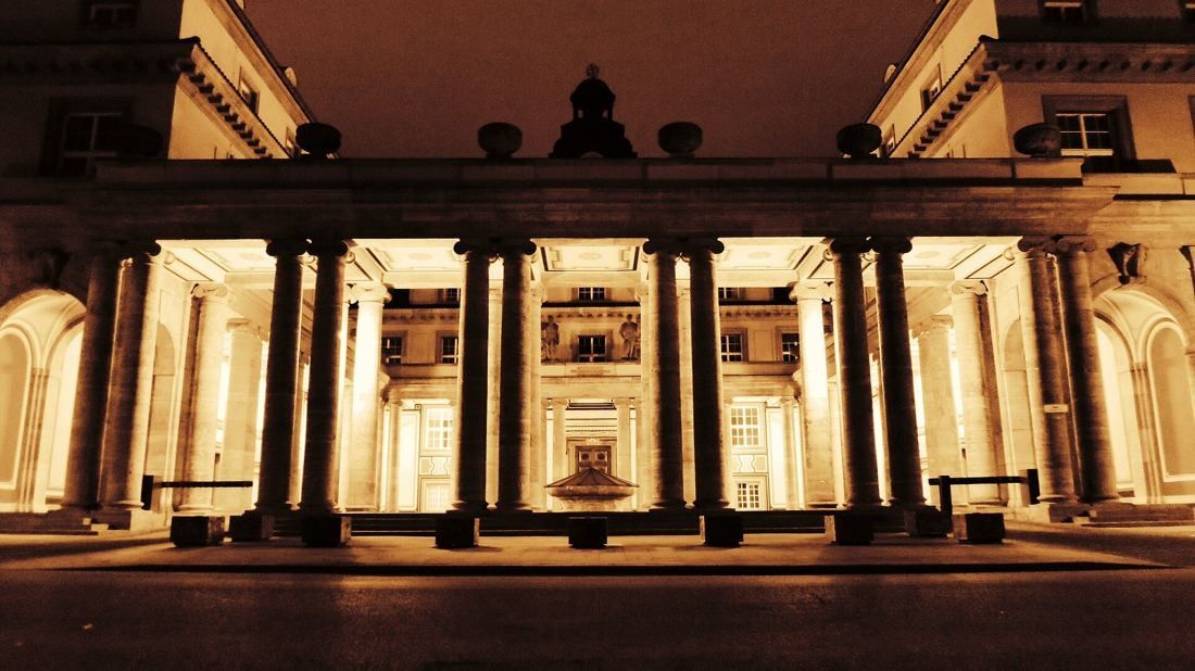 Munich Re: Colonnade lit warmly at night