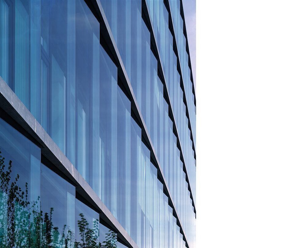 Munich Re: Layered blue-green glass façade in close-up