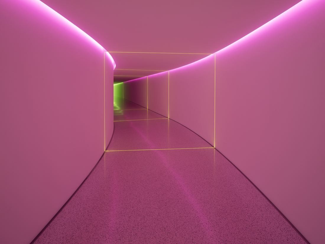 Munich Re: Long curving passage washed in pink light