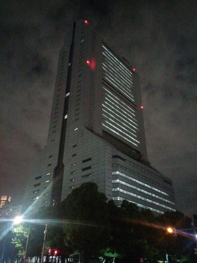 NEC: Tower at night with red aviation lights