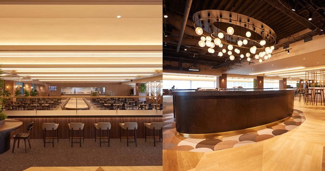 NEC: Two views of a warm wood-toned café floor with long tables, bar stools and a round counter under a ring of globe lights