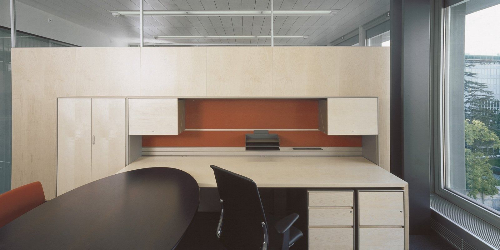 Nestlé: A cellular office with a desk and shelving