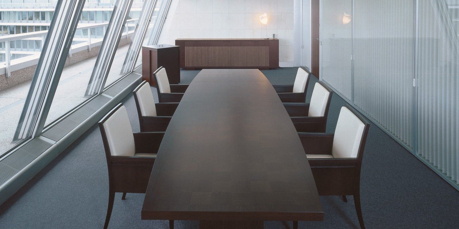 Nestlé: A long boardroom table by a glass wall