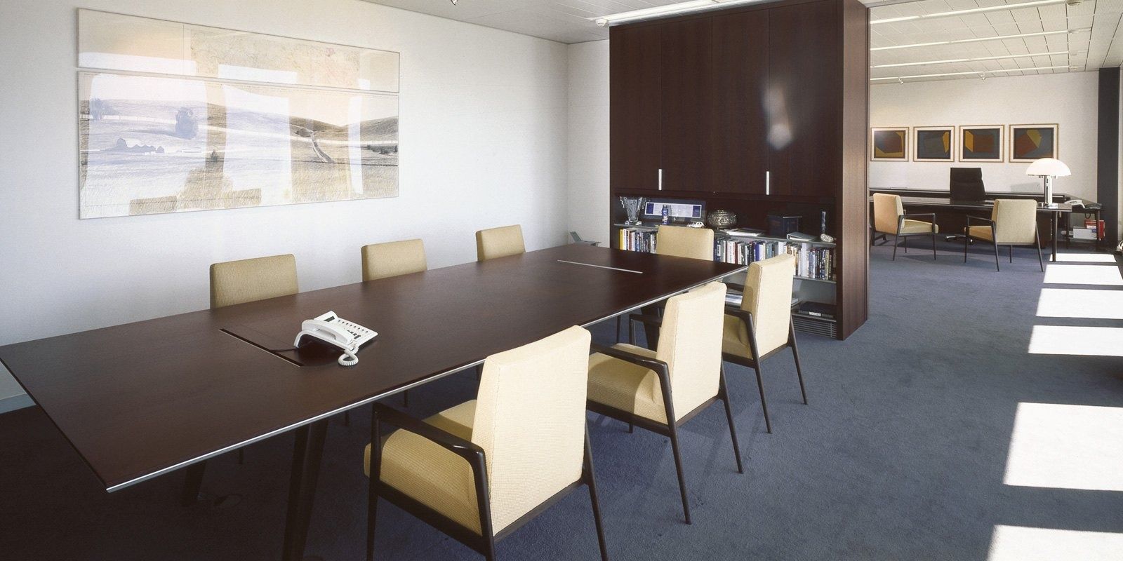 Nestlé: A meeting room with dark wood and pale chairs