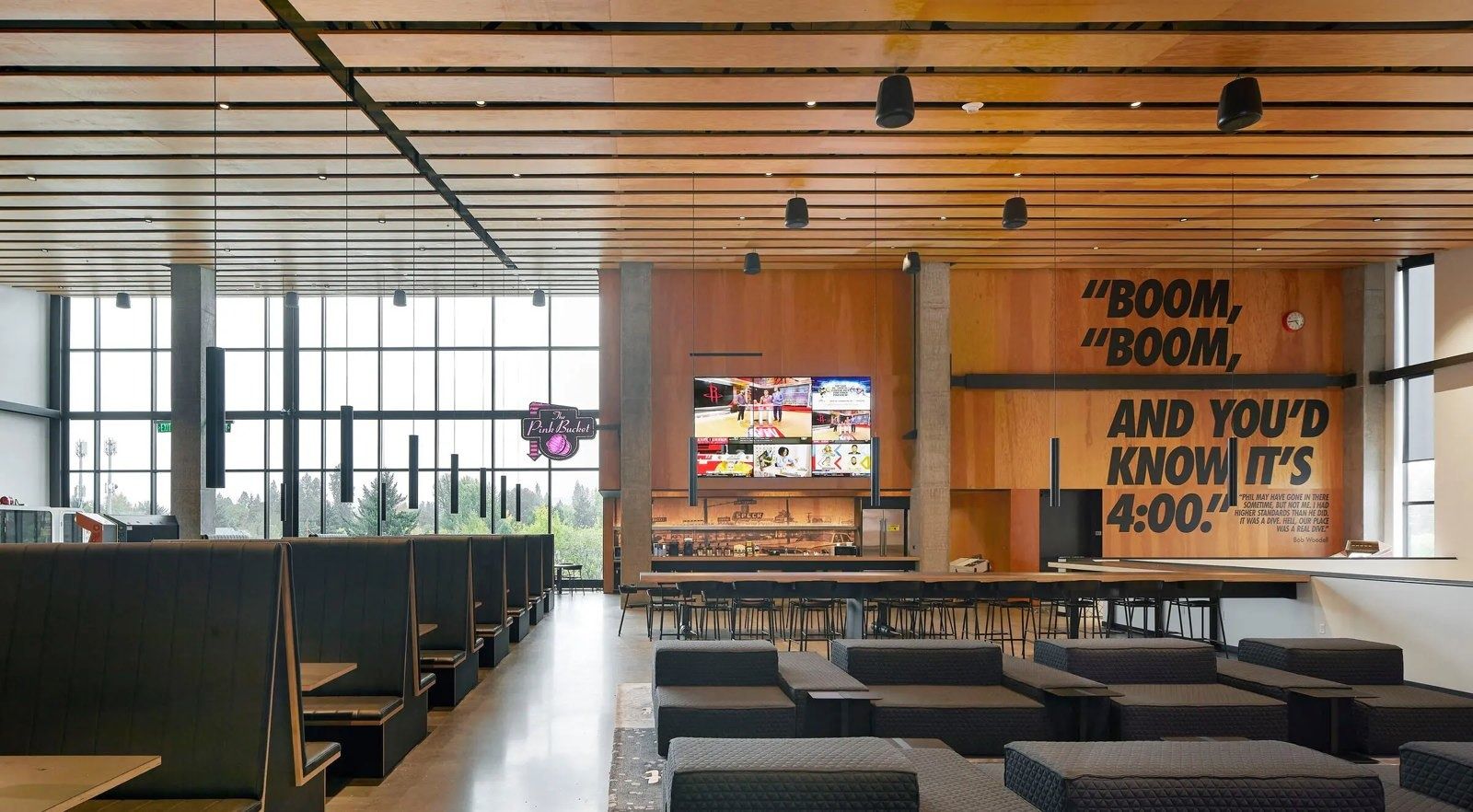 Nike: A lounge with booths and a red neon sign