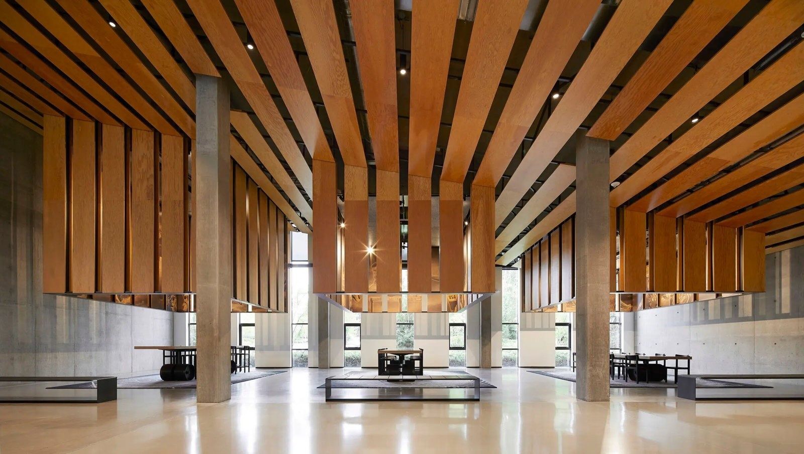 Nike: A tall atrium with timber slats and a long reception