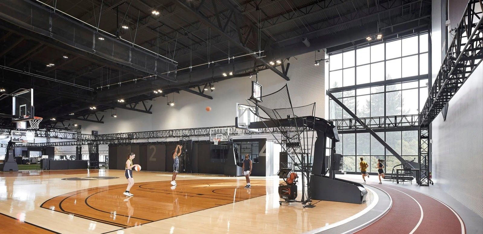 Nike: An indoor basketball court with a running track