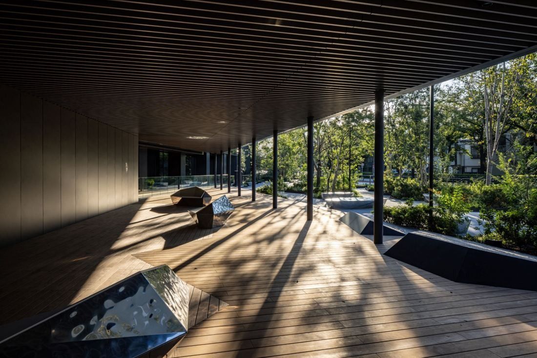 Nikon: Shaded wooden deck under a deep overhang facing trees