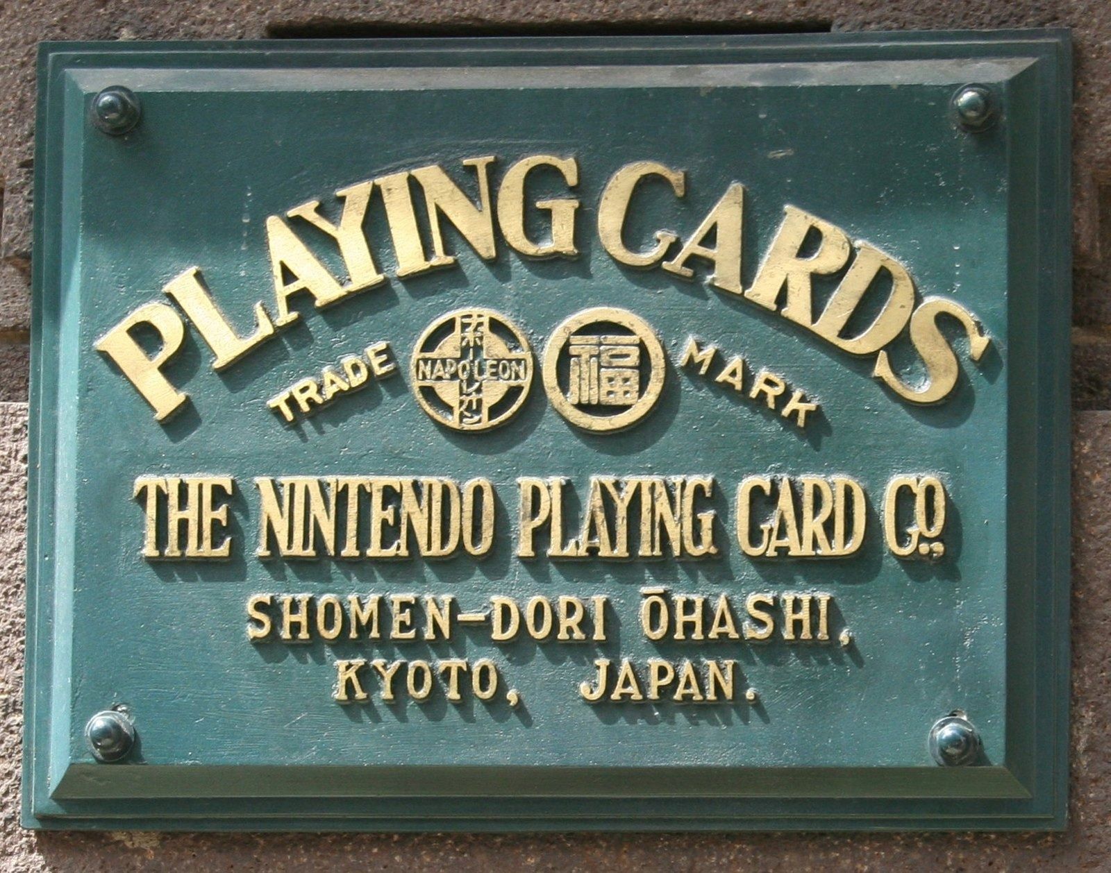 Nintendo: A brass plate reading The Nintendo Playing Card Co.