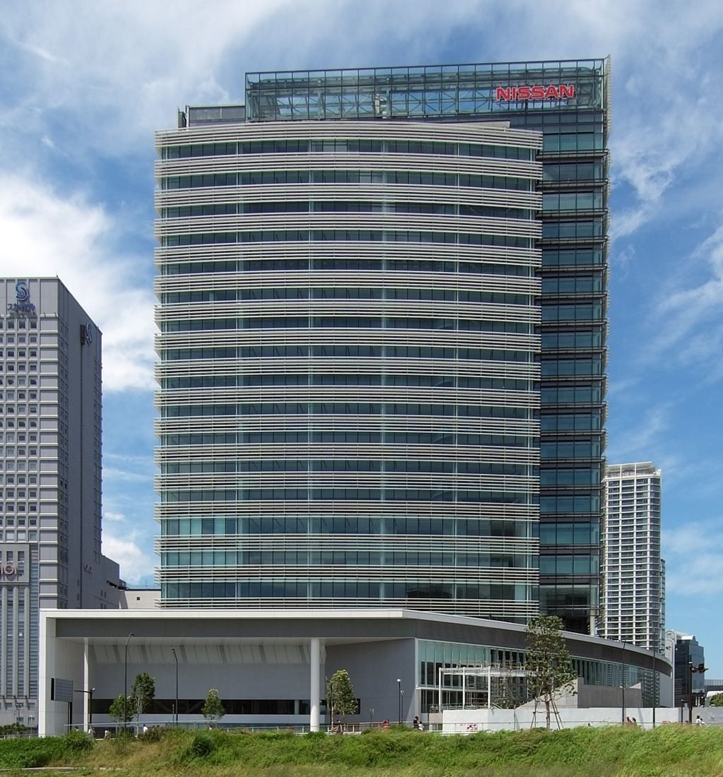 Nissan: Glass tower with horizontal louvres rising above a low white podium