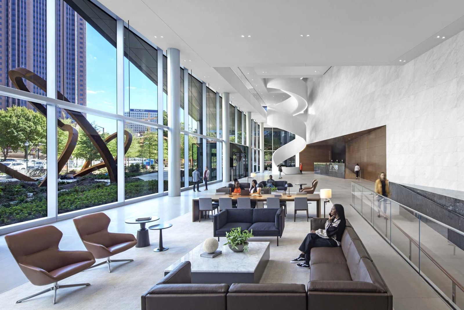 Norfolk Southern: A long lounge by tall windows overlooking a steel sculpture