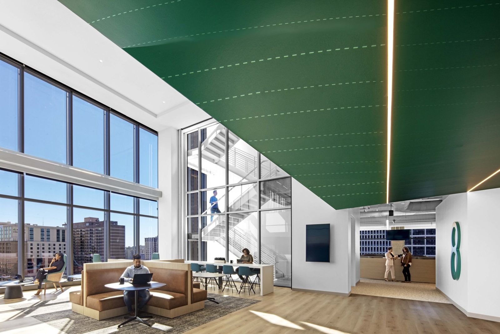 Norfolk Southern: Double-height break room with booths and a green ceiling