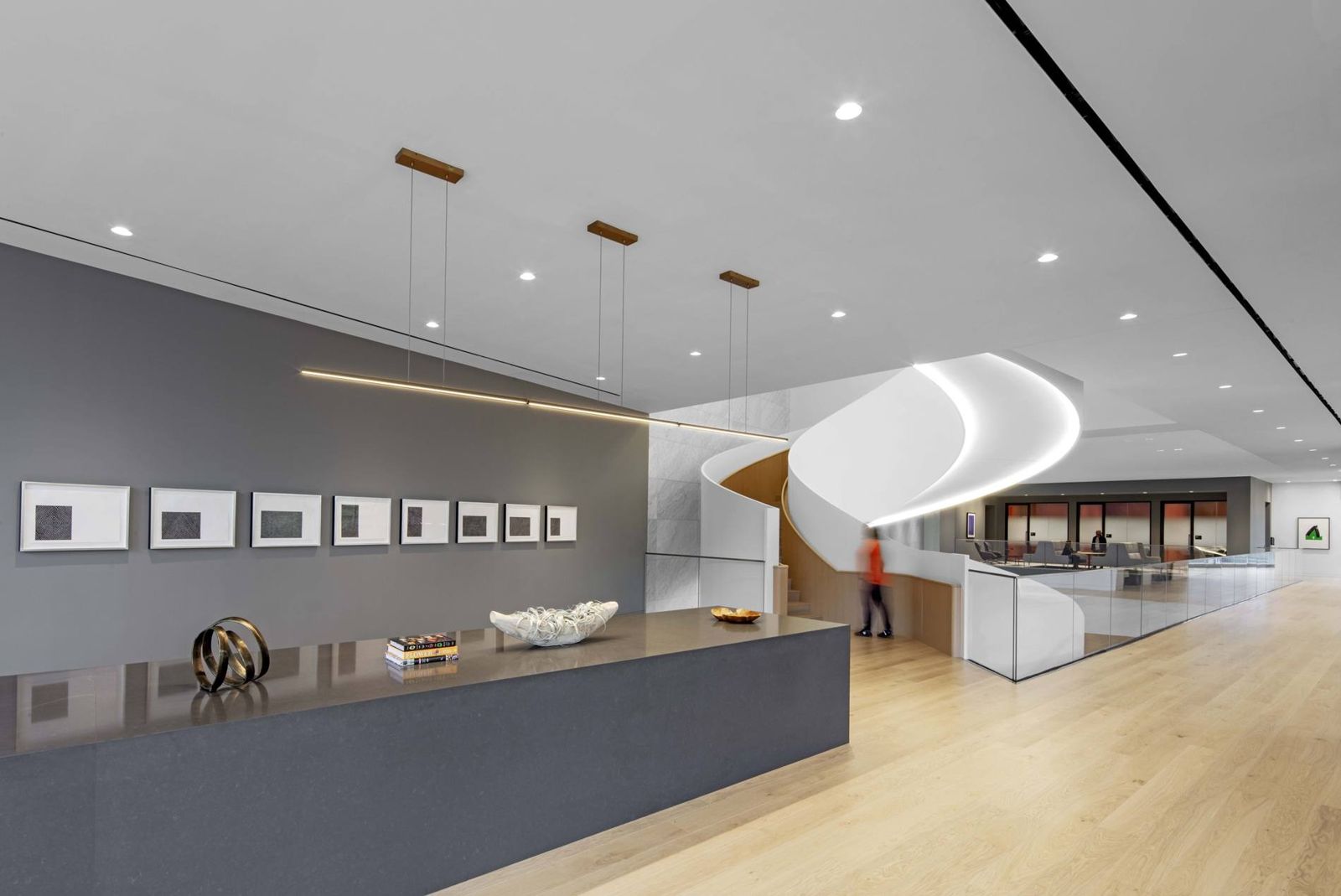 Norfolk Southern: Front desk with a gray wall of small artworks