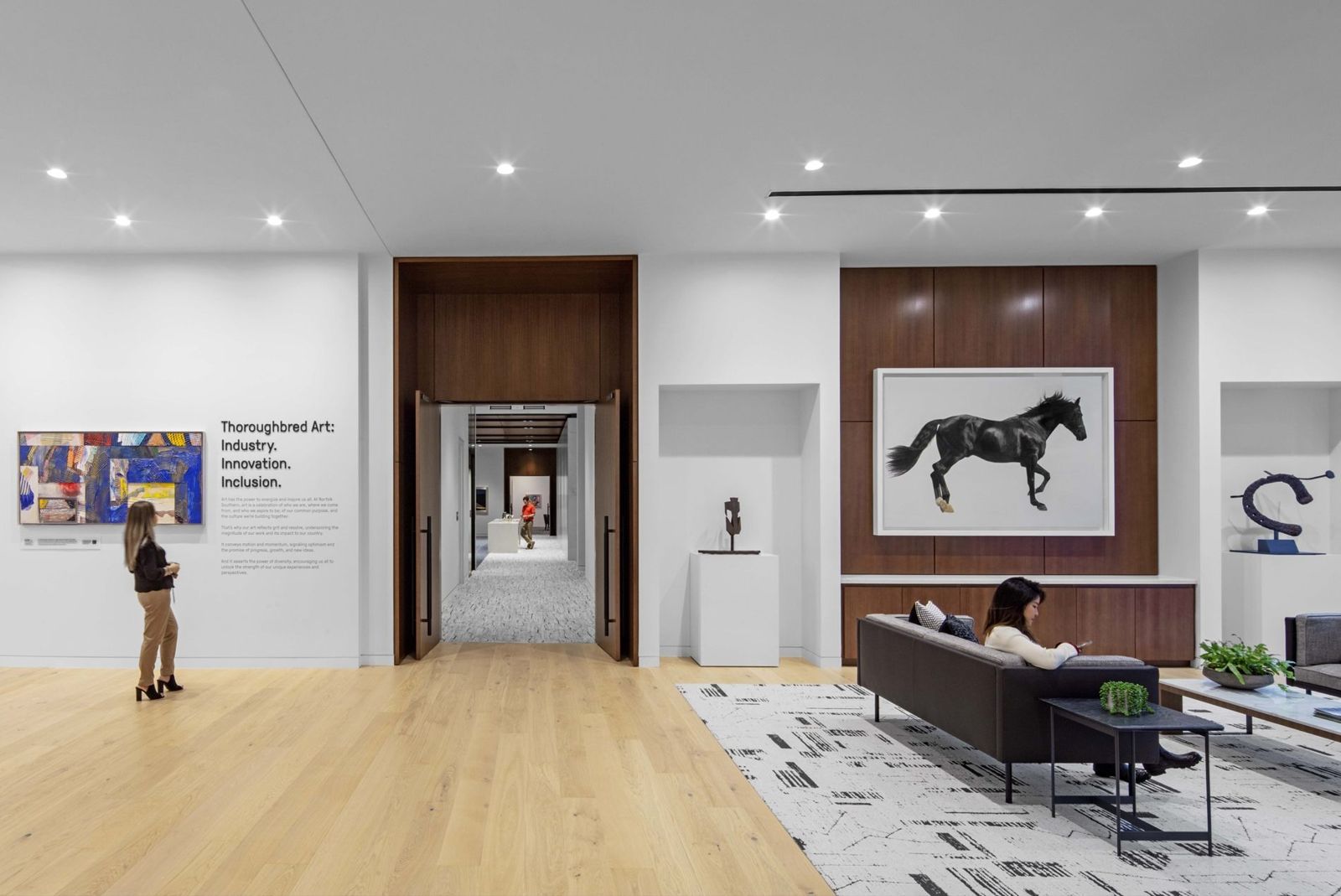 Norfolk Southern: Gallery with a horse photograph and a sofa