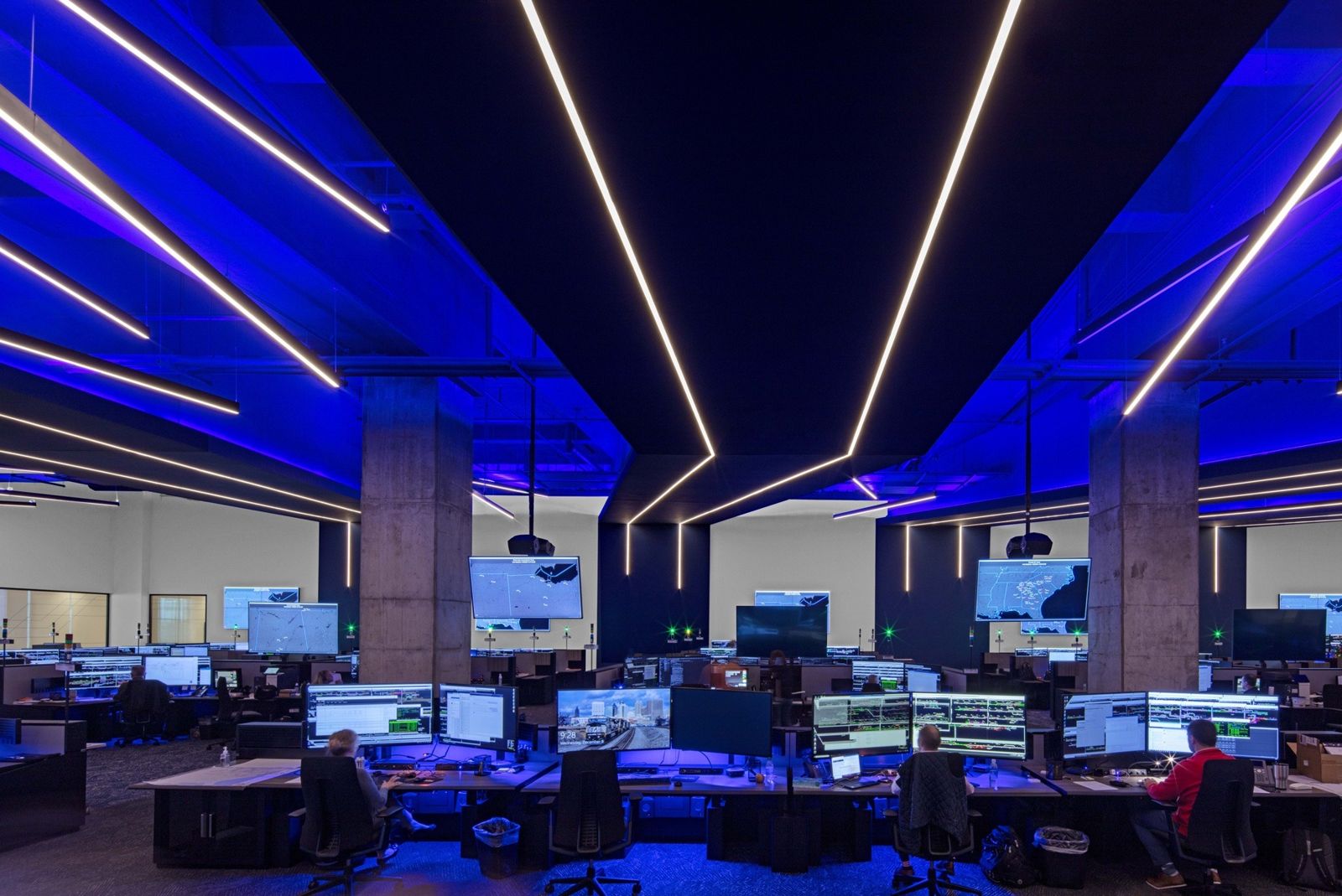 Norfolk Southern: Rows of monitors in a dark room lit with blue lines