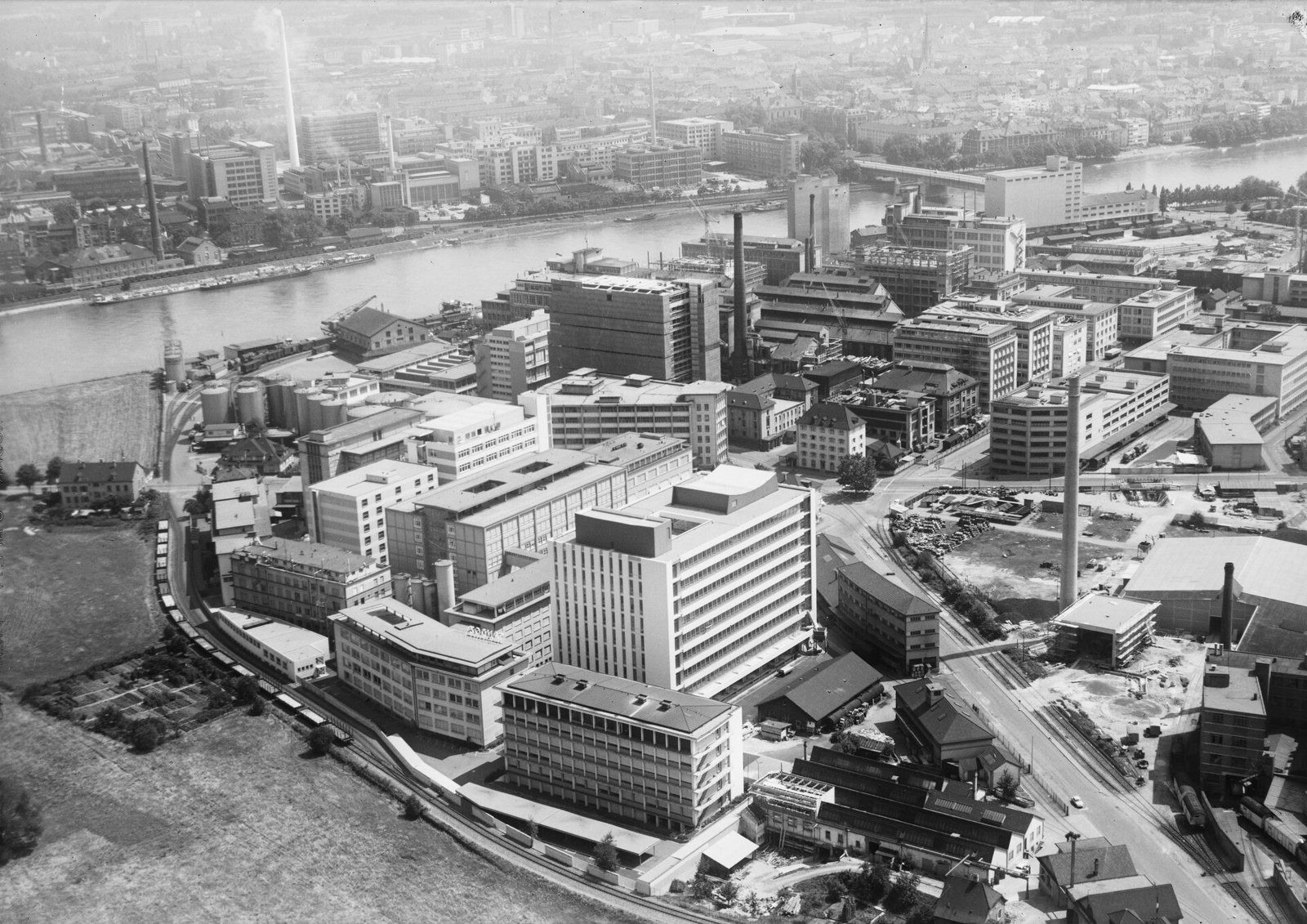 Black-and-white aerial view of the Sandoz works by the Rhine