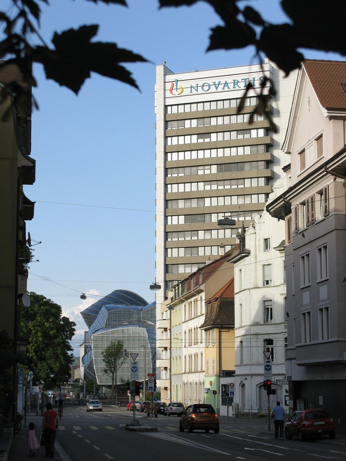 Novartis: Street view with a tall Novartis tower
