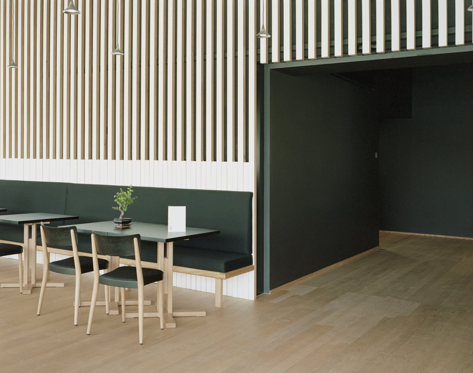 Novartis: Tables beside a striped wooden wall