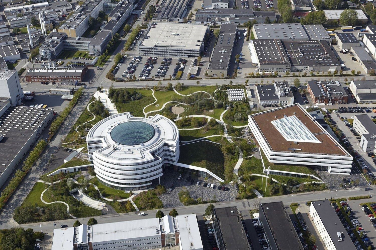 An aerial view of the round headquarters in its park