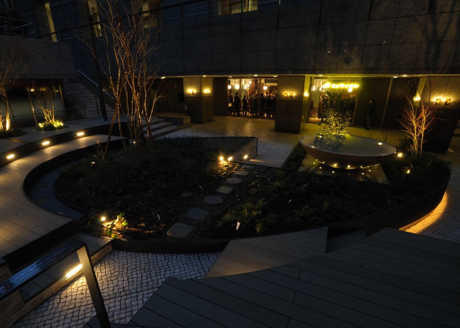 NTT: Garden plaza at night with low lights