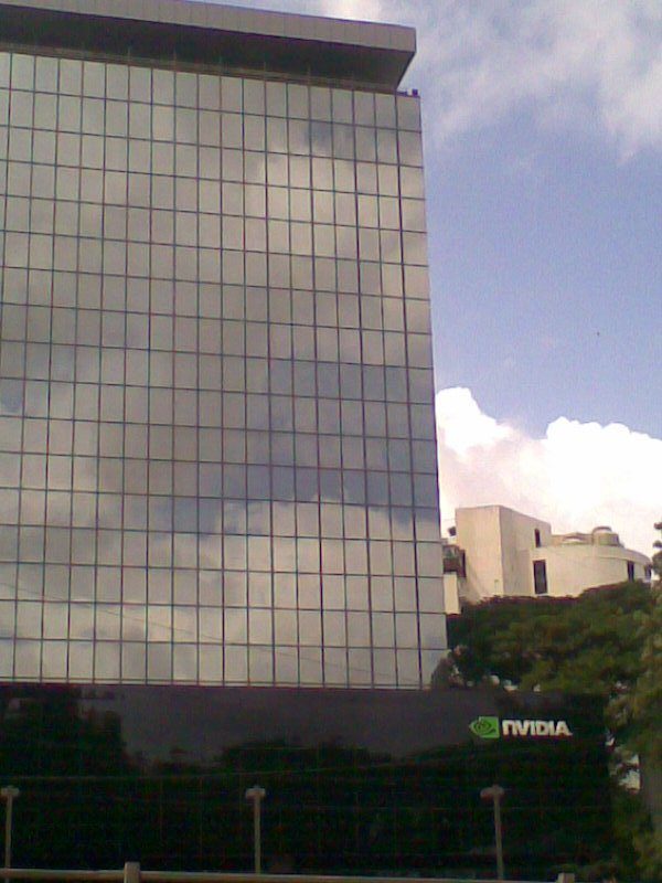 Glass building with a small NVIDIA sign