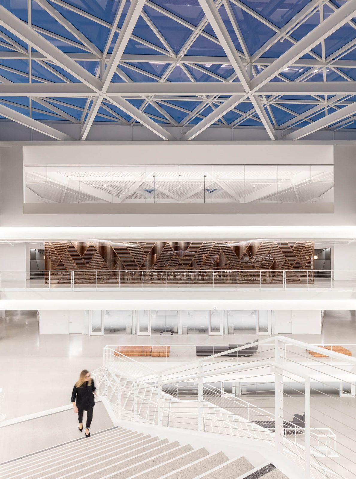 A white staircase under the glass roof