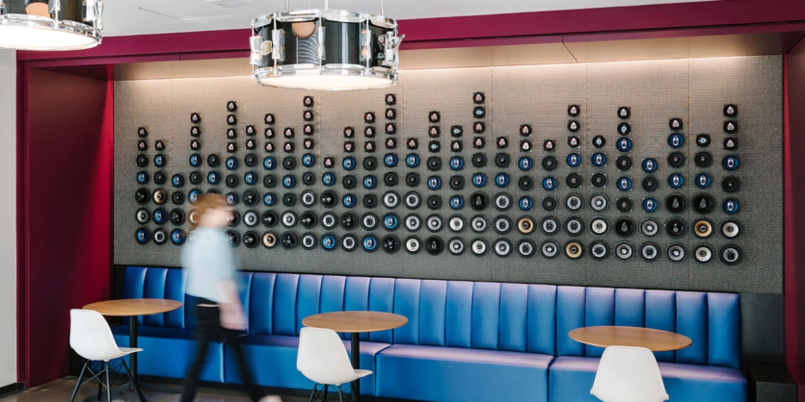 Oracle: A booth under a wall of speakers styled as a music equalizer
