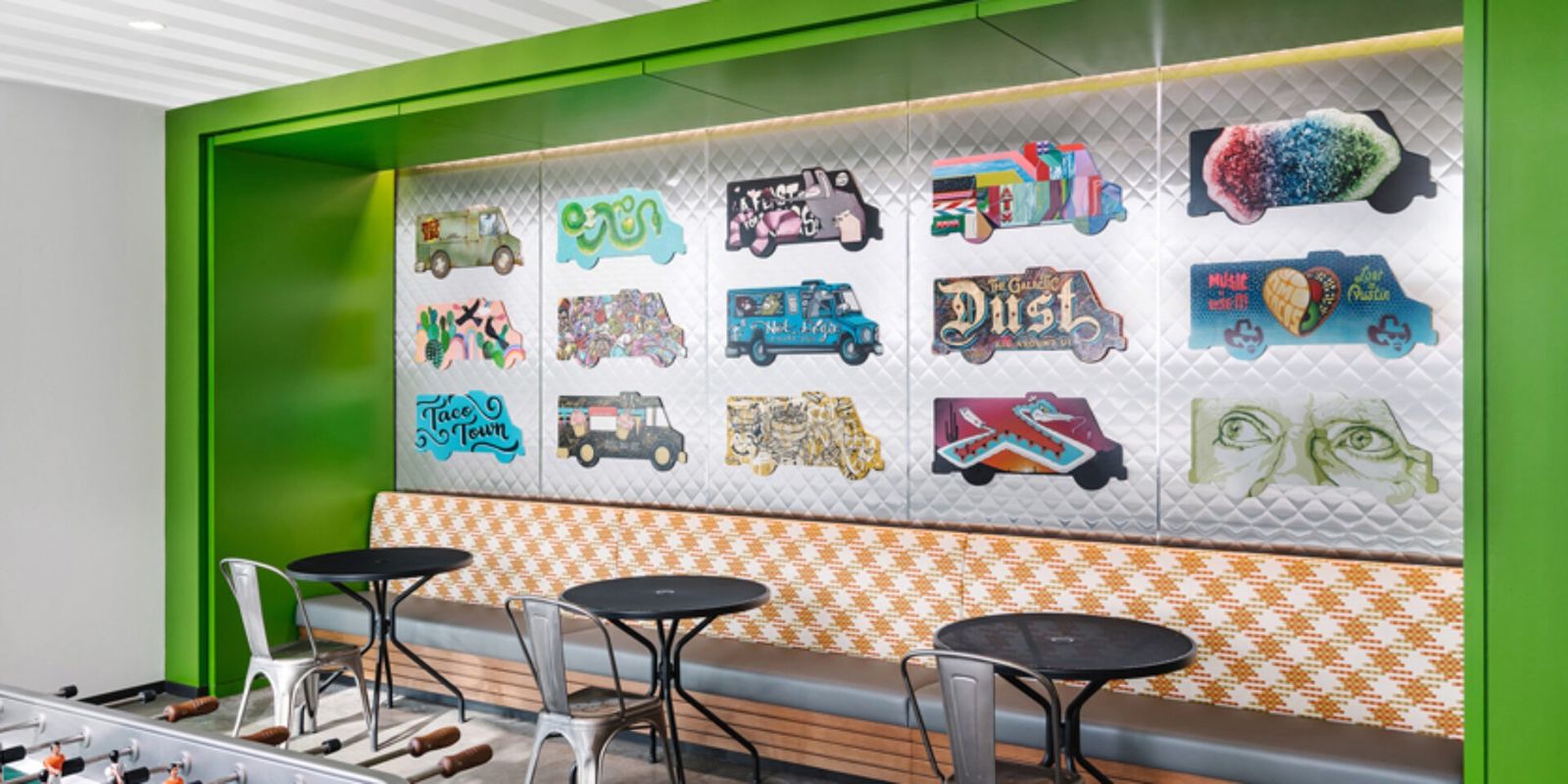 Oracle: Food trucks painted by local artists above café seating