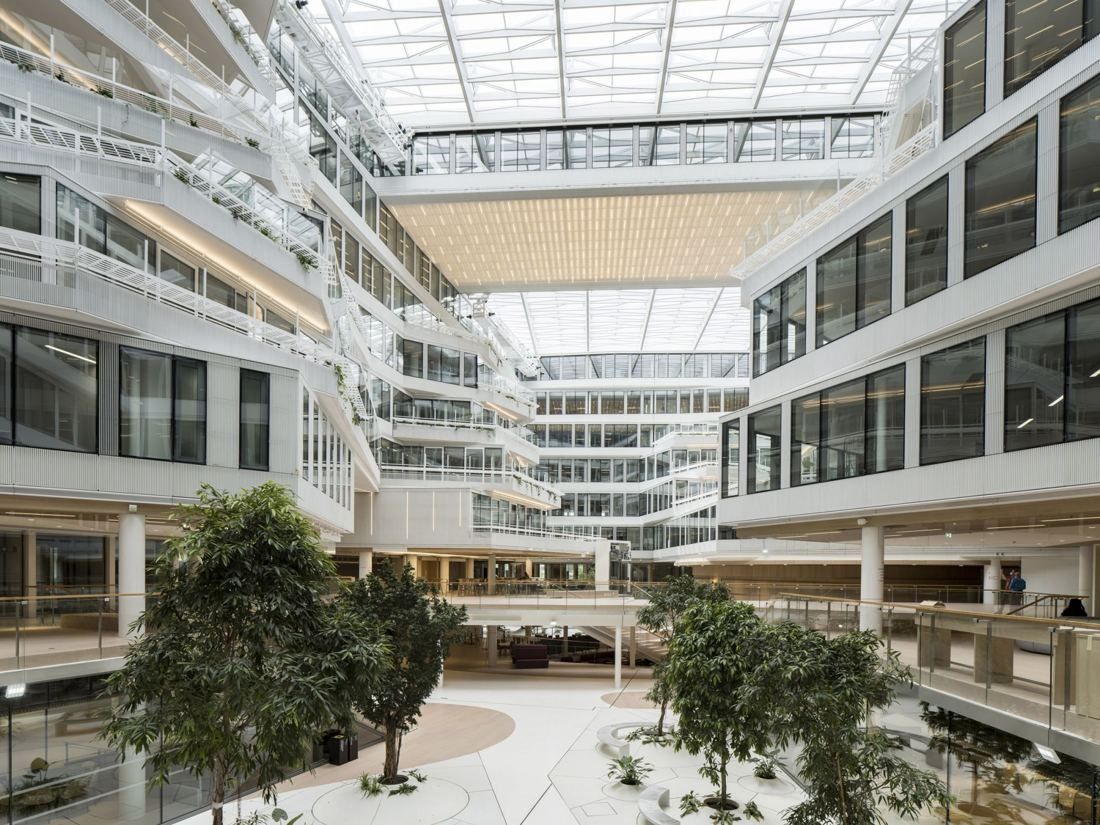 Orange: Glass-roofed atrium with trees planted on the ground floor and office galleries on every level