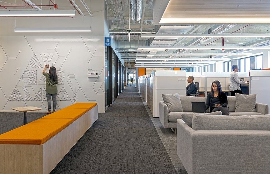 Palo Alto Networks: A corridor with an orange bench and team seating
