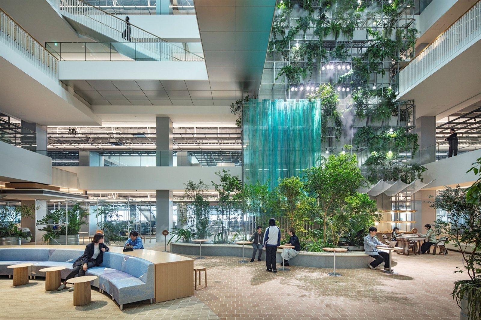 Panasonic: Four-storey atrium filled with trees, a hanging green-glass sculpture and lounge seating