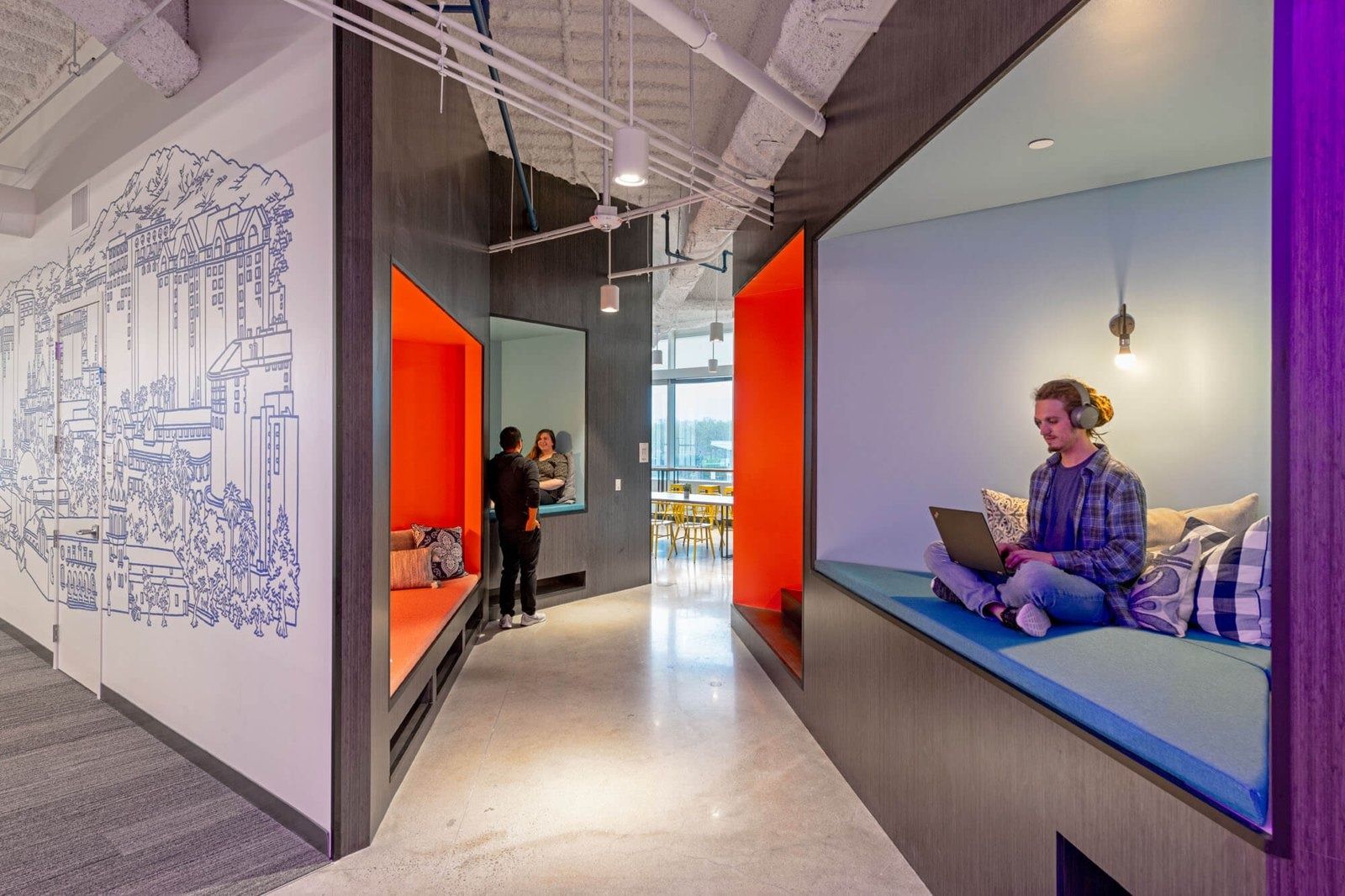 PayPal: Colorful window nooks along a mural corridor