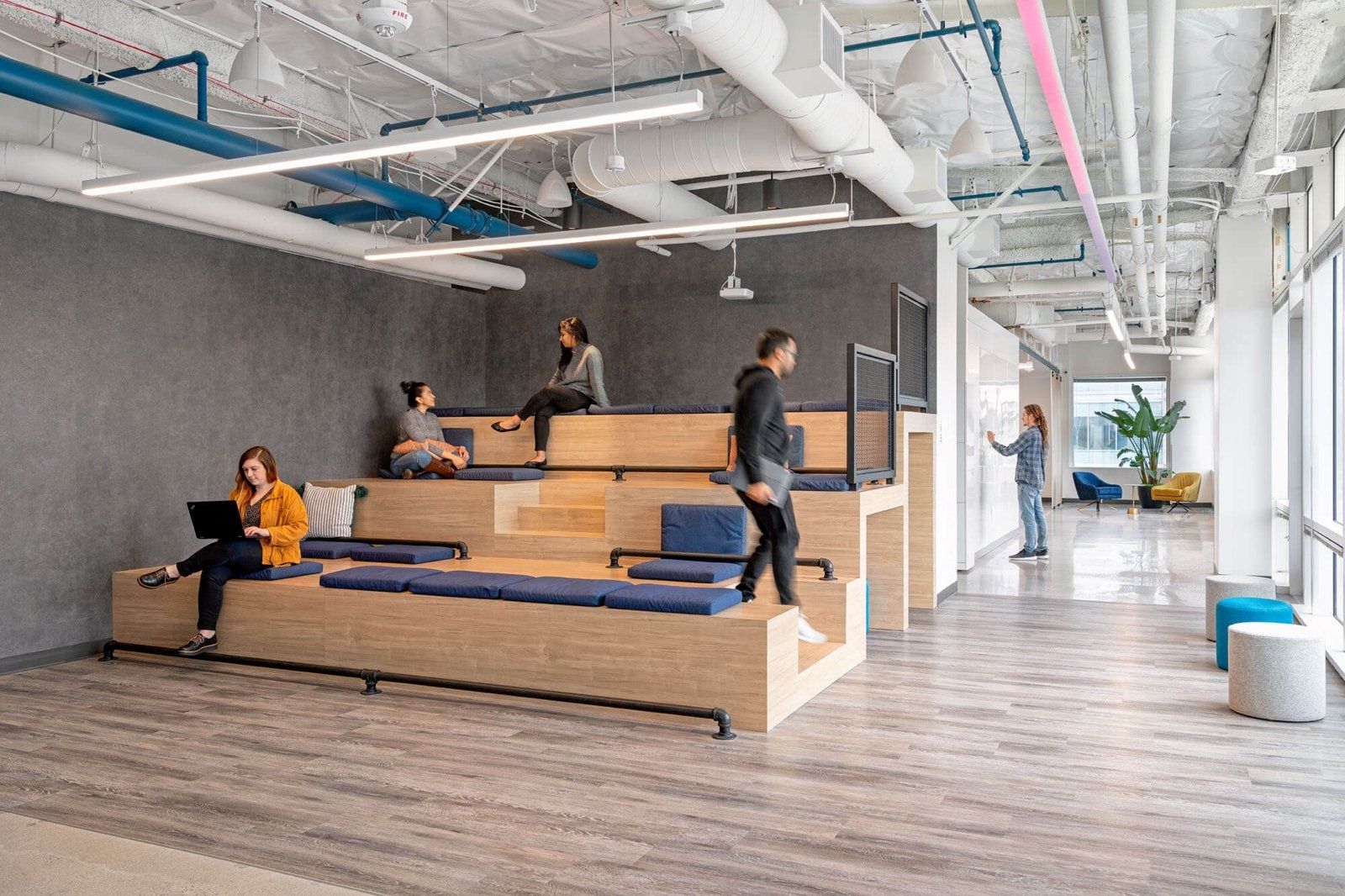 PayPal: Stepped wooden seating in an open office
