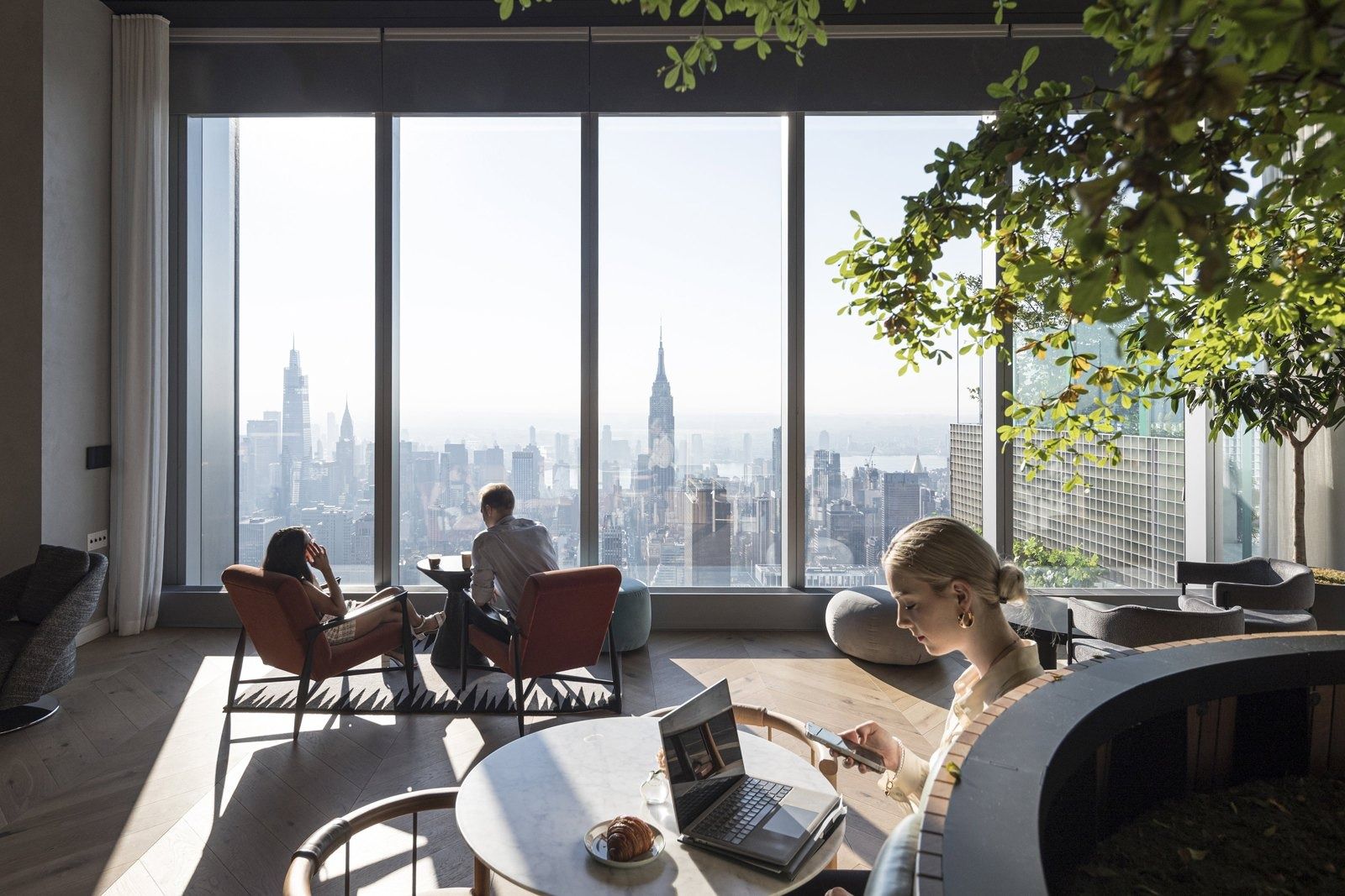 Pfizer: A lounge with tall windows looking toward Midtown